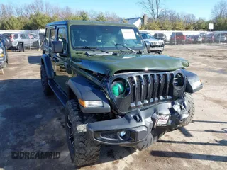 2020 Jeep Wrangler Unlimited Sport S with VIN 1C4HJXDG9LW328034, listed as a IAAI auction lot 41808054 with 48,781 mi miles and . Bid and sale history available at DreamBid. Image 1.