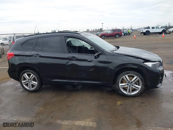 2021 BMW X1 xDrive28i with VIN WBXJG9C01M3M71033, listed as a IAAI auction lot 41723970 with 71,000 mi miles. Bid and sale history available at carsss.com. Image 13.