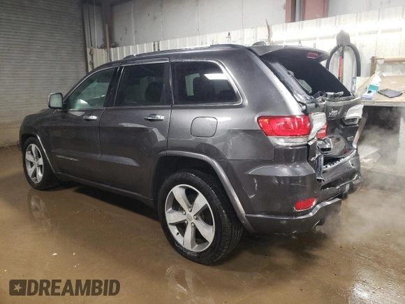 2015 Jeep Grand Cherokee Overland with VIN 1C4RJFCT2FC613502, listed as a Copart auction lot 89207005 with 124,482 mi miles and Salvage Title. Bid and sale history available at carsss.com. Image 2.