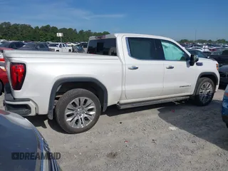 2020 GMC Sierra 1500 Denali z VIN 1GTU9FEL8LZ203683, wystawiony jako IAAI lot #42225894 z przebiegiem 42 577 mil mil oraz . Historia ofert i sprzedaży dostępna na DreamBid. Obrazek 4.