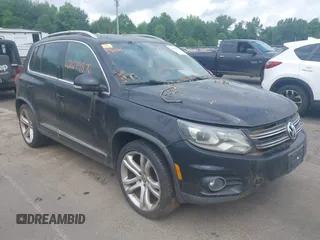2014 Volkswagen Tiguan S with VIN WVGBV3AX6EW074398, listed as a IAAI auction lot 42679876 with 155,101 mi miles and . Bid and sale history available at DreamBid. Image 1.