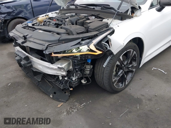2023 Kia K5 GT-Line z VIN 5XXG64J25PG220733, wystawiony jako IAAI lot #42109640 z przebiegiem 30 917 mil mil oraz . Historia ofert i sprzedaży dostępna na DreamBid. Obrazek 6.