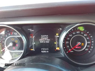 2021 Jeep Wrangler Unlimited Rubicon with VIN 1C4HJXFG2MW575541, listed as a IAAI auction lot 42247475 with 92,353 mi miles and . Bid and sale history available at DreamBid. Image 7.