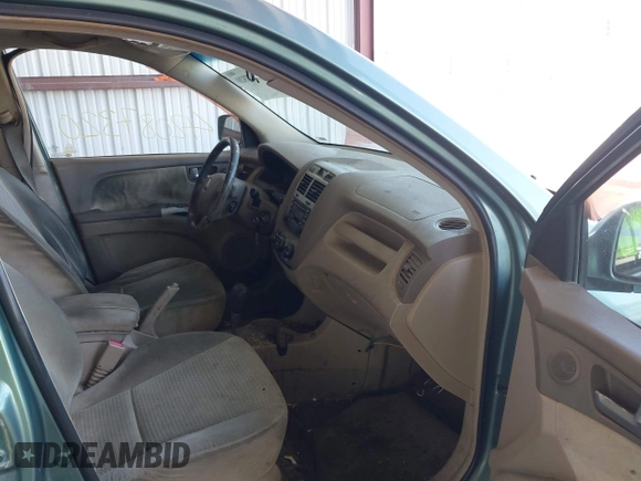 2005 Kia Sportage LX with VIN KNDJF723957065883, listed as a IAAI auction lot 42087320 with 212,726 mi miles and . Bid and sale history available at carsss.com. Image 5.