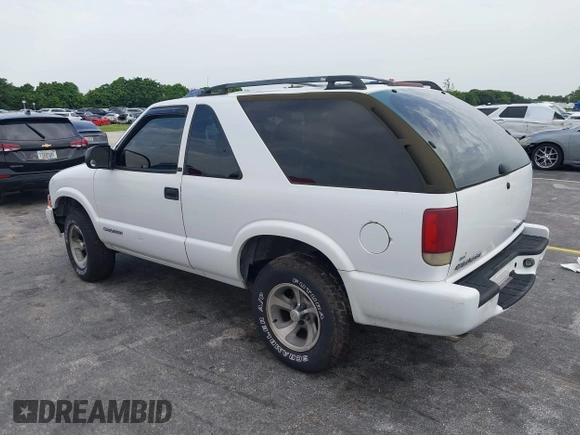 2003 Chevrolet Blazer Xtreme z VIN 1GNCS18X33K152868, wystawiony jako IAAI lot #39801584 z przebiegiem 167 157 mil mil oraz . Historia ofert i sprzedaży dostępna na DreamBid. Obrazek 3.