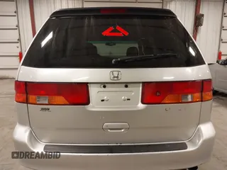 2004 Honda Odyssey EX-L with VIN 5FNRL18974B127696, listed as a IAAI auction lot 41643243 with 200,286 mi miles and . Bid and sale history available at DreamBid. Image 17.