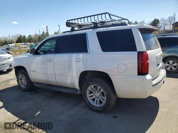 2019 Chevrolet Tahoe LT with VIN 1GNSKBKC5KR137818, listed as a Copart auction lot 50654885 with 138,334 mi miles and Salvage title. Bid and sale history available at DreamBid. Image 2.