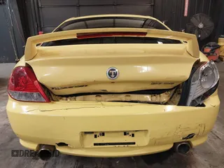 2006 Hyundai Tiburon GT z VIN KMHHN65F56U225936, wystawiony jako IAAI lot #41695280 z przebiegiem 121 110 mil mil oraz . Historia ofert i sprzedaży dostępna na DreamBid. Obrazek 6.