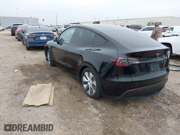 2023 Tesla Model Y Long Range z VIN 7SAYGDEEXPA181114, wystawiony jako IAAI lot #41564617 z przebiegiem 64 990 mil mil oraz . Historia ofert i sprzedaży dostępna na DreamBid. Obrazek 3.