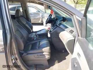 2011 Honda Odyssey EX-L with VIN 5FNRL5H60BB072101, listed as a IAAI auction lot 42002097 with 243,607 mi miles. Bid and sale history available at carsss.com. Image 5.