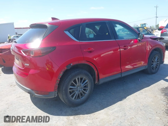 2019 Mazda CX-5 Touring with VIN JM3KFACM5K1516242, listed as a IAAI auction lot 42019803 with 113,953 mi miles. Bid and sale history available at carsss.com. Image 4.
