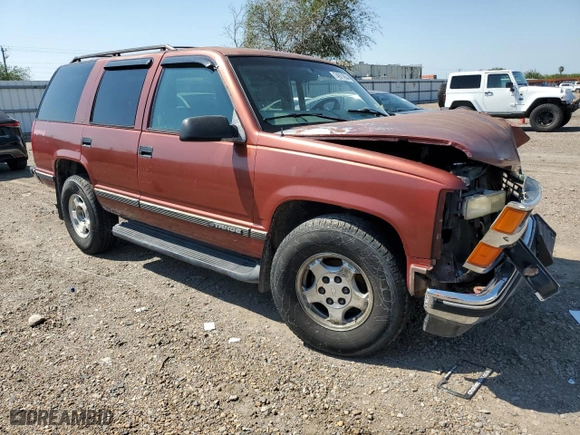 1999 Chevrolet Tahoe Z71 with VIN 1GNEK13R0XJ474557, listed as a Copart auction lot 74971964 with 217,027 mi miles and Salvage Title. Bid and sale history available at carsss.com. Image 4.