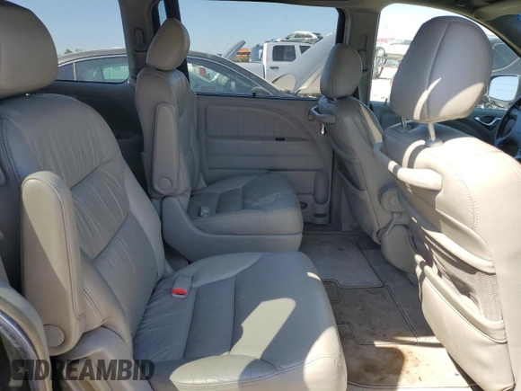 2006 Honda Odyssey Touring z VIN 5FNRL38876B123895, wystawiony jako Copart lot #56414355 z przebiegiem 248 142 mil mil oraz Szkoda całkowita • Salvage title. Historia ofert i sprzedaży dostępna na DreamBid. Obrazek 11.