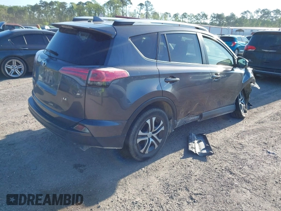 2016 Toyota RAV4 LE with VIN JTMZFREV7GJ065267, listed as a IAAI auction lot 42011267 with 180,127 mi miles. Bid and sale history available at carsss.com. Image 4.