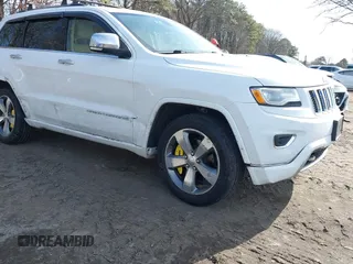 2016 Jeep Grand Cherokee Overland with VIN 1C4RJFCTXGC312476, listed as a IAAI auction lot 41606707 with 145,627 mi miles and . Bid and sale history available at DreamBid. Image 1.