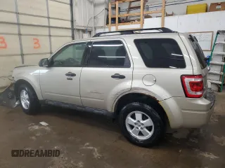 2012 Ford Escape XLT with VIN 1FMCU9D76CKC44981, listed as a Copart auction lot 57908795 with 127,594 mi miles and Salvage title. Bid and sale history available at DreamBid. Image 2.