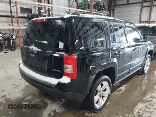 2014 Jeep Patriot Limited with VIN 1C4NJRCB8ED910340, listed as a IAAI auction lot 41396065 with 241,669 mi miles. Bid and sale history available at carsss.com. Image 4.
