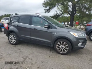 2017 Ford Escape Titanium with VIN 1FMCU0J98HUF09588, listed as a Copart auction lot 48988765 with 101,887 mi miles and Salvage Title. Bid and sale history available at DreamBid. Image 4.