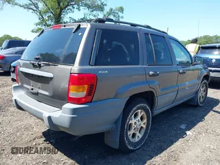 2000 Jeep Grand Cherokee Laredo with VIN 1J4GW48S8YC380039, listed as a IAAI auction lot 42510307 with 215,776 mi miles and . Bid and sale history available at DreamBid. Image 4.