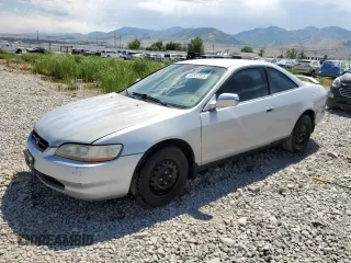 2000 Honda Accord LX with VIN 1HGCG3246YA033148, listed as a Copart auction lot 60552915 with 183,387 mi miles and Salvage title. Bid and sale history available at DreamBid. Image 1.