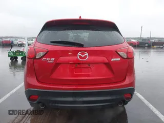 2015 Mazda CX-5 Touring with VIN JM3KE4CY3F0529669, listed as a IAAI auction lot 41866873 with 137,635 mi miles and . Bid and sale history available at carsss.com. Image 16.