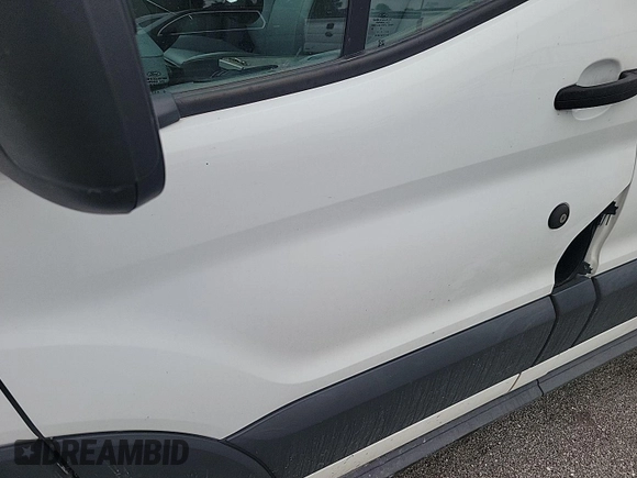 2016 Ford Transit Cargo z VIN 1FTYE1YM1GKB15643, wystawiony jako IAAI lot #42585640 z przebiegiem 301 257 mil mil oraz . Historia ofert i sprzedaży dostępna na DreamBid. Obrazek 34.