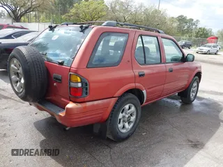 1999 Isuzu Rodeo S z VIN 4S2CK58W4X4318644, wystawiony jako IAAI lot #41693386 z przebiegiem 295 147 mil mil oraz . Historia ofert i sprzedaży dostępna na DreamBid. Obrazek 4.