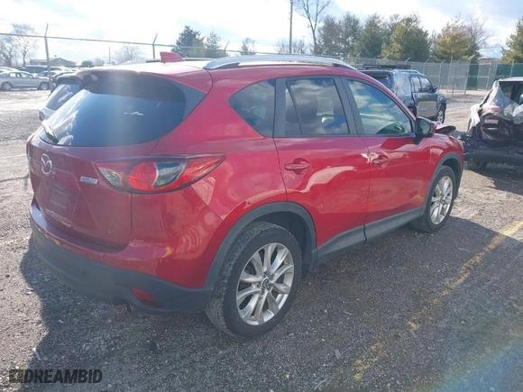 2014 Mazda CX-5 Grand Touring with VIN JM3KE2DY8E0373064, listed as a IAAI auction lot 41683791 with 186,970 mi miles. Bid and sale history available at carsss.com. Image 4.