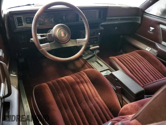 1987 Oldsmobile Cutlass z VIN 1G3GR1195HP307304, wystawiony jako Copart lot #83901444 z przebiegiem 4856 mil mil oraz Nie do naprawy. Historia ofert i sprzedaży dostępna na DreamBid. Obrazek 8.
