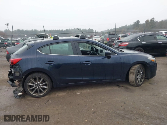 2018 Mazda 3 Touring with VIN 3MZBN1L34JM204883, listed as a IAAI auction lot 41094541 with 125,205 mi miles and . Bid and sale history available at DreamBid. Image 13.