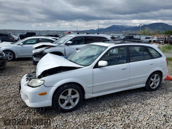 2002 Mazda Protege z VIN JM1BJ245721470434, wystawiony jako Copart lot #57293765 z przebiegiem 144 622 mil mil oraz Szkoda całkowita • Salvage title. Historia ofert i sprzedaży dostępna na DreamBid. Obrazek 1.