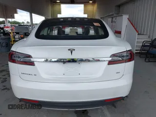 2014 Tesla Model S 60 with VIN 5YJSA1S16EFP53350, listed as a IAAI auction lot 42239753 with 104,985 mi miles and . Bid and sale history available at DreamBid. Image 16.