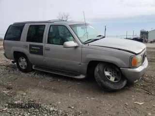 1999 GMC Denali with VIN 1GKEK13R0XR915053, listed as a Copart auction lot 49241145 with 2,664,121 mi miles and Salvage Title. Bid and sale history available at carsss.com. Image 4.