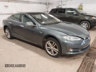 2013 Tesla Model S with VIN 5YJSA1CN9DFP13148, listed as a IAAI auction lot 41936472 with 167,811 mi miles. Bid and sale history available at carsss.com. Image 1.