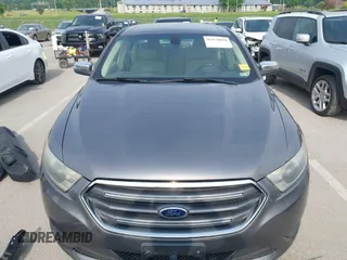 2013 Ford Taurus Limited z VIN 1FAHP2F8XDG185782, wystawiony jako IAAI lot #42474018 z przebiegiem 181 144 mil mil oraz . Historia ofert i sprzedaży dostępna na DreamBid. Obrazek 12.