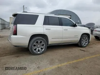 2015 GMC Yukon Denali with VIN 1GKS1CKJ1FR619793, listed as a Copart auction lot 86910314 with 128,559 mi miles and Salvage Title. Bid and sale history available at carsss.com. Image 3.