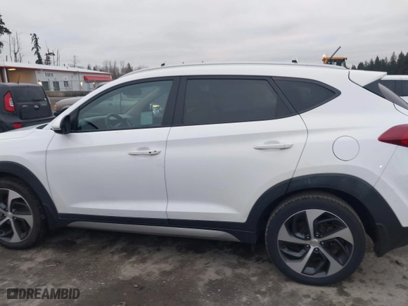 2017 Hyundai Tucson Value with VIN KM8J33A28HU301869, listed as a IAAI auction lot 41288511 with 111,143 mi miles. Bid and sale history available at carsss.com. Image 14.