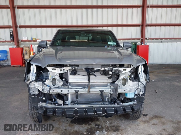 2025 Toyota Tacoma SR with VIN 3TMLB5JN7SM100983, listed as a IAAI auction lot 42220559 with 2,119 mi miles and . Bid and sale history available at DreamBid. Image 13.