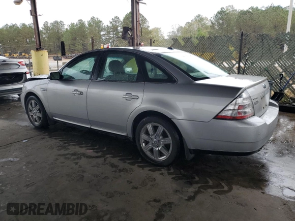 2009 Ford Taurus Limited with VIN 1FAHP25W09G100990, listed as a Copart auction lot 80745234 with 129,692 mi miles and Salvage Title. Bid and sale history available at carsss.com. Image 2.
