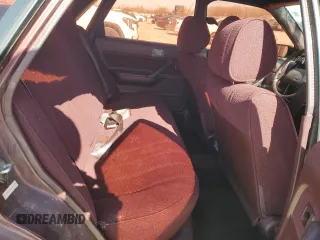 1989 Toyota Camry DLX z VIN 4T1SV21E3KU053153, wystawiony jako Copart lot #49917485 z przebiegiem 79 028 mil mil oraz Szkoda całkowita • Salvage title. Historia ofert i sprzedaży dostępna na DreamBid. Obrazek 10.