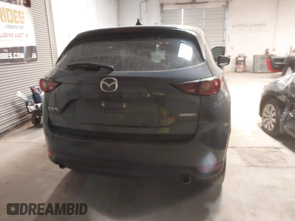 2021 Mazda CX-5 Touring with VIN JM3KFACM9M0379508, listed as a IAAI auction lot 41577251 with 46,519 mi miles. Bid and sale history available at carsss.com. Image 16.