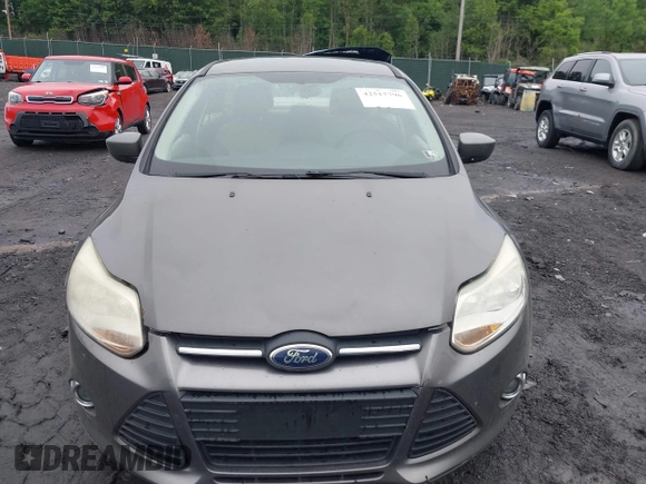 2012 Ford Focus SE z VIN 1FAHP3F29CL442731, wystawiony jako IAAI lot #42517796 z przebiegiem 148 728 mil mil oraz . Historia ofert i sprzedaży dostępna na DreamBid. Obrazek 12.