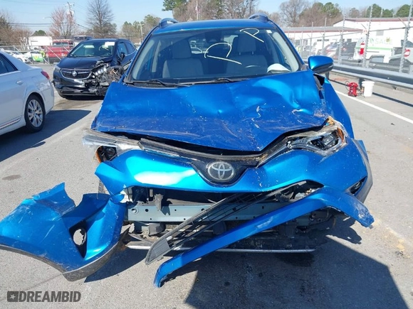 2018 Toyota RAV4 XLE with VIN JTMWFREV7JJ730968, listed as a IAAI auction lot 41778761 with 122,102 mi miles. Bid and sale history available at carsss.com. Image 12.