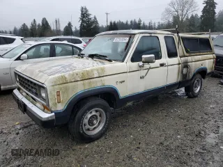 1988 Ford Ranger z VIN 1FTCR14T0JPB89741, wystawiony jako Copart lot #87283094 z przebiegiem 80 867 mil mil oraz Czysty tytuł • Clean title. Historia ofert i sprzedaży dostępna na DreamBid. Obrazek 1.