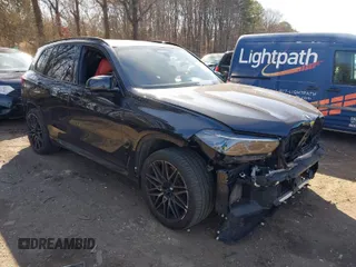 2022 BMW X5 M with VIN 5YMJU0C00N9J23747, listed as a IAAI auction lot 41731912 with 44,899 mi miles. Bid and sale history available at carsss.com. Image 1.