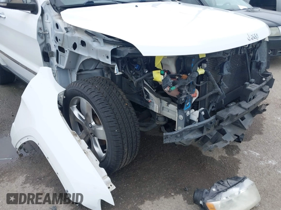 2013 Jeep Grand Cherokee Overland with VIN 1C4RJECG5DC648593, listed as a IAAI auction lot 41576630 with 187,098 mi miles. Bid and sale history available at carsss.com. Image 6.