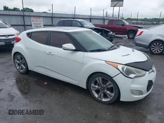 2012 Hyundai Veloster w/Gray Int z VIN KMHTC6ADXCU074298, wystawiony jako IAAI lot #42353923 z przebiegiem 129 114 mil mil oraz . Historia ofert i sprzedaży dostępna na DreamBid. Obrazek 1.