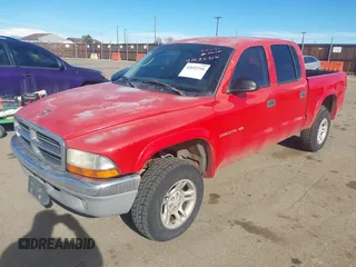 2002 Dodge Dakota SLT z VIN 1B7HG48N32S518455, wystawiony jako IAAI lot #41652316 z przebiegiem 234 856 mil mil oraz . Historia ofert i sprzedaży dostępna na DreamBid. Obrazek 2.