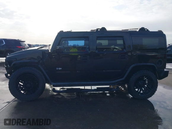 2003 Hummer H2 z VIN 5GRGN23UX3H112173, wystawiony jako IAAI lot #41093359 z przebiegiem Nie podano mil oraz . Historia ofert i sprzedaży dostępna na DreamBid. Obrazek 15.