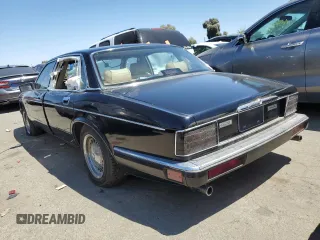 1990 Jaguar XJ with VIN SAJKY1745LC622713, listed as a Copart auction lot 56545414 with Not Provided miles and Salvage Title. Bid and sale history available at DreamBid. Image 2.
